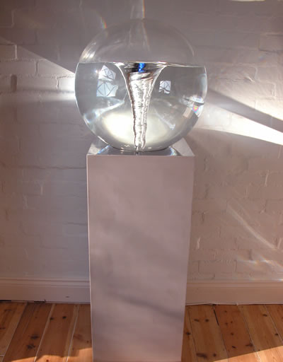 Vortex globe feature on stainless steel plinth